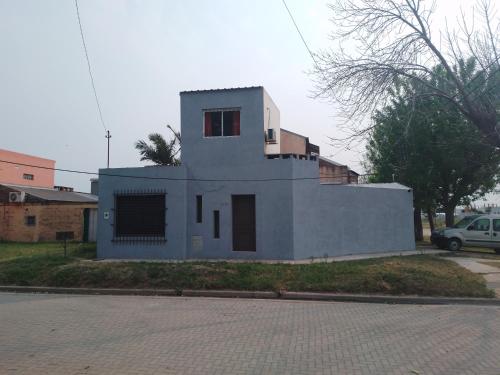 a small white house on the side of a street at Don Jose in Piquete
