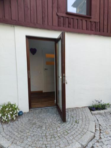 a door to a building with a heart on it at TOSKANA Nadarzyn in Nadarzyn