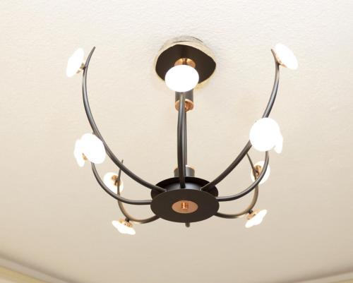 a chandelier hanging from a ceiling at Mayfair 1 Bedroom-Bukoto in Kampala