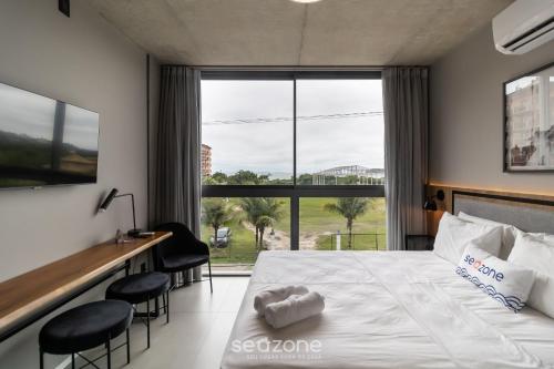 Cama o camas de una habitación en Spot Jurere sofisticación junto al mar - SPJ's