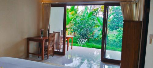 Voodi või voodid majutusasutuse Srijaya Ubud by SHM toas