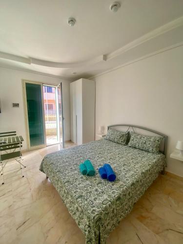Una cama o camas en una habitación de La Logghia rooms