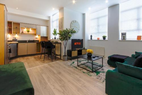 a living room with a couch and a table at The Lanes Royale - Rose Platinum Properties in Brighton & Hove