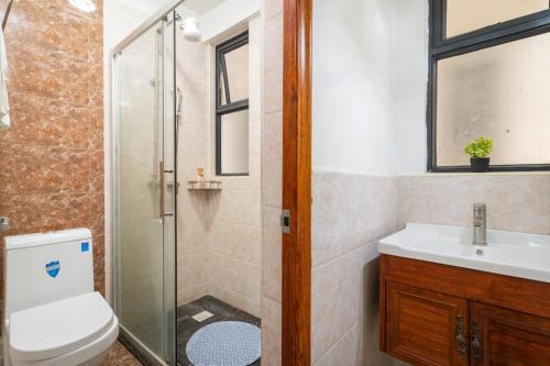 a bathroom with a toilet sink and a shower at 1 Bed and exta bedroom at Kilimani Yaya centre-Nairobi in Nairobi