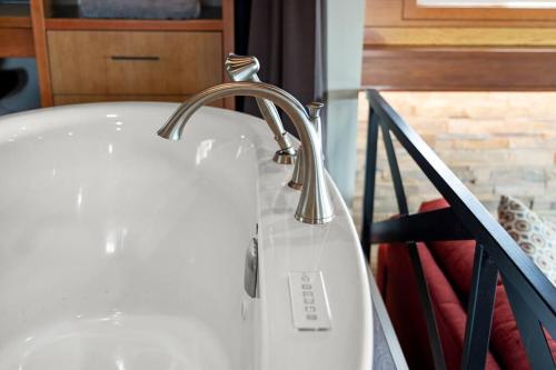 a sink with a faucet in a bathroom at The Feather in Victoria