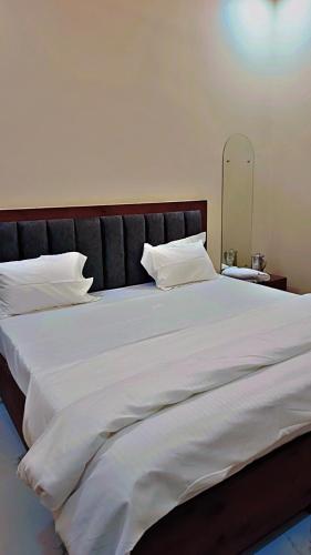 Postel nebo postele na pokoji v ubytování The Ocean Inn Home Stay