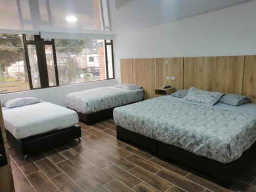 Postel nebo postele na pokoji v ubytování Aw Hotel Ariston Embassy