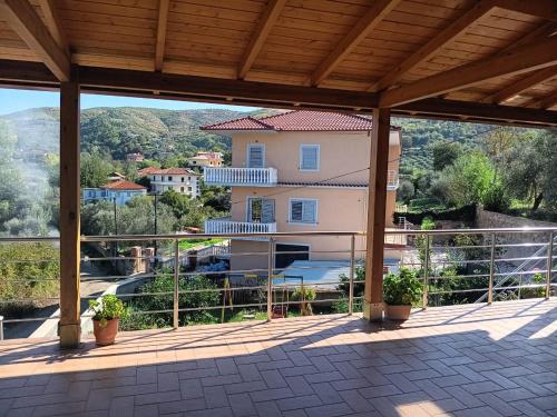 a view of a house from a balcony at Beqiri Apartment in Belsh