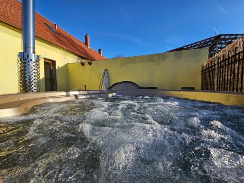 a hot tub in the backyard of a house at Vířivka a sauna na pokoji,nebo na vlastní terase - Farma u Příbrami in Příbram