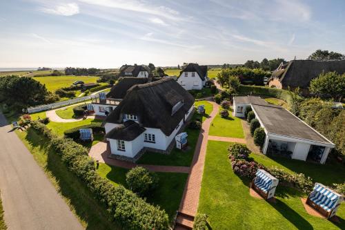 an aerial view of a house with a roof at Haus Amanda in Norddorf