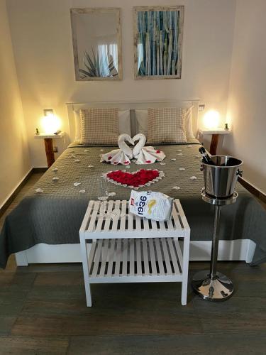 a bedroom with a bed with two towels on it at Casa vacanze green house in Terrasini