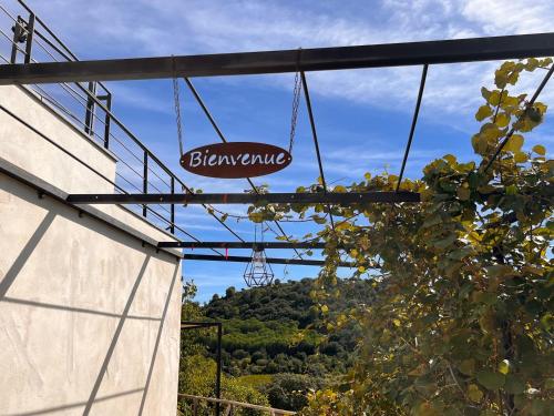 a sign that reads shawarma hanging from a building at Gite Les Fées Natu' in Vendémian