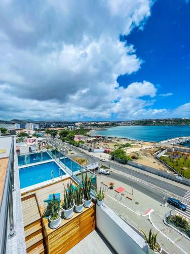 a view of the water from a balcony of a building at Résidence Cazino Apartamentos in Praia