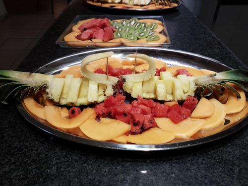 a tray of fruit on top of a table at B&B Lu Casale in San Cesario di Lecce
