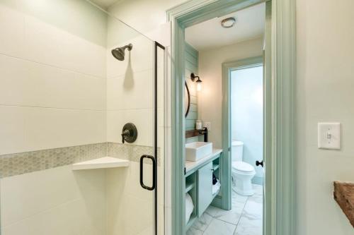 a bathroom with a shower and a sink at The Ashley Carriage House Suite Includes Breakfast in Charleston