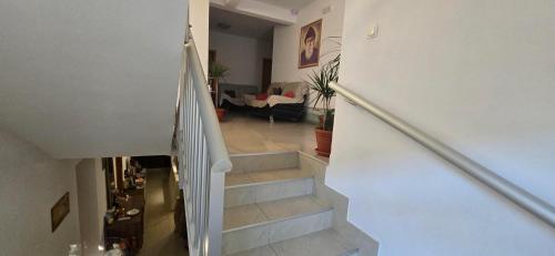 a staircase in a house with a living room at Hotel Sebastian in Međugorje
