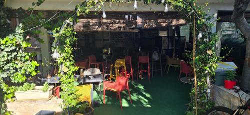 a patio with a bunch of chairs and tables at Hotel Sebastian in Međugorje