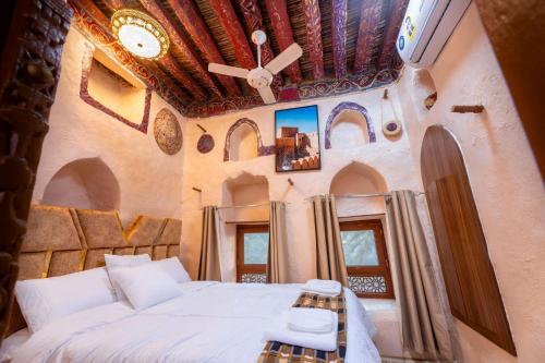 Manazil Inn نزل المنازلにあるベッド