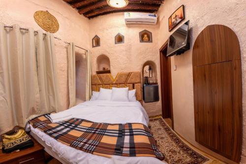 Manazil Inn نزل المنازلにあるベッド