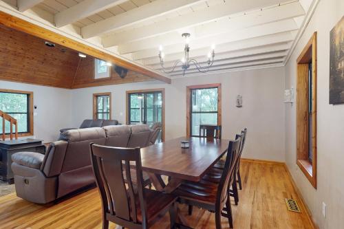 a dining room with a table and a couch at 50 South View Trail in Jasper