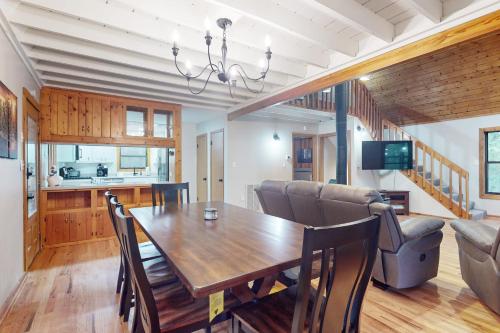 a dining room and living room with a table and chairs at 50 South View Trail in Jasper