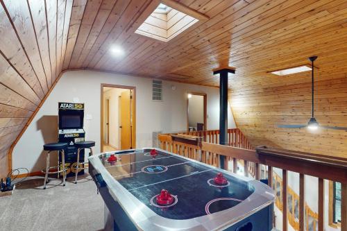 a room with a ping pong table on a balcony at 50 South View Trail in Jasper