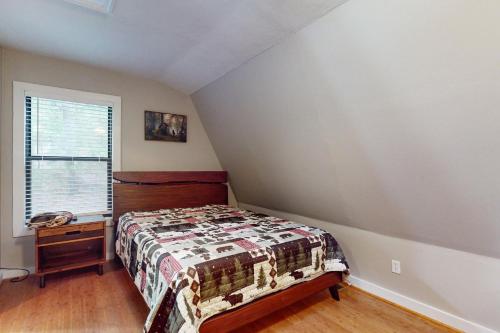 a bedroom with a bed and a dresser and a window at 50 South View Trail in Jasper