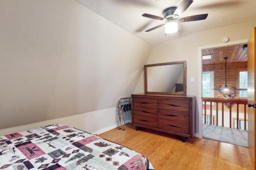 a bedroom with a bed and a dresser and a mirror at 50 South View Trail in Jasper