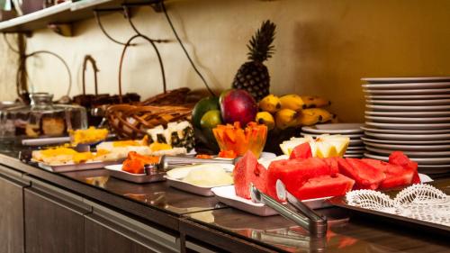 a buffet with many different types of fruits and vegetables at Nobile Plaza Hotel in Taguatinga