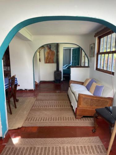 a bedroom with a bed in the middle of a room at AMPLIO LOFT con PISCINA in Curicó