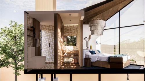 a bedroom with a bed and a large window at Primario Hotel Boutique in Ensenada