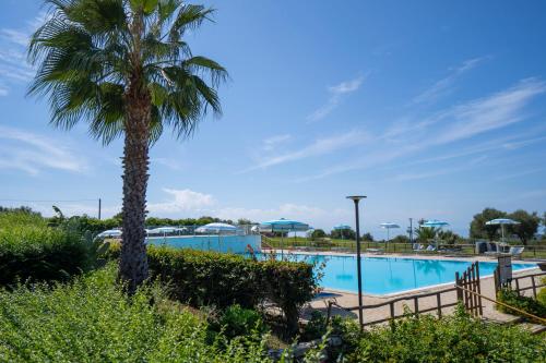 Bazén v ubytování Ninea Panoramic Family Apartments - large pool with sea view nebo v jeho okolí
