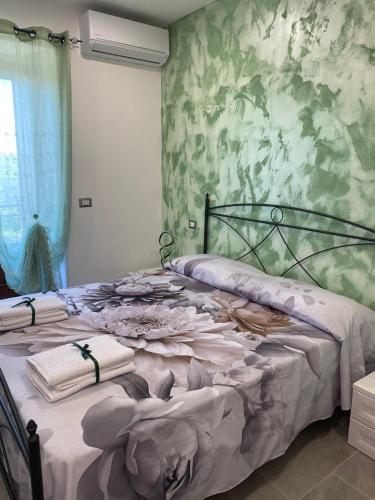 a bedroom with two beds with towels on them at GuestHouse Affittacamere Padre Pio MORCONE CENTRO in Morcone