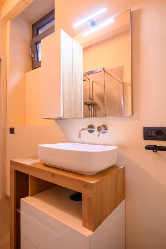 a bathroom with a white sink and a mirror at Casale Bellavista 1853, Cremia, Lago di Como in Cremia