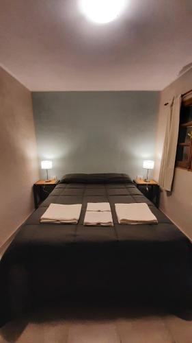 Ένα ή περισσότερα κρεβάτια σε δωμάτιο στο Hostal El Museo