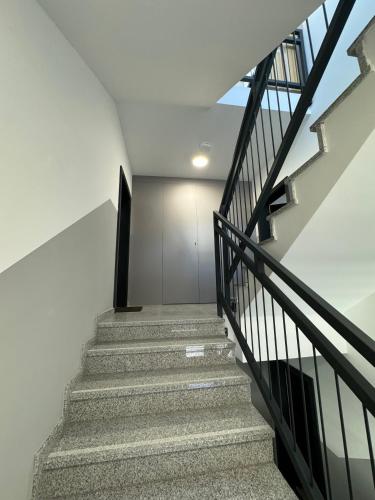 a staircase in a building with a stair case at Abra Apartment X in Poznań
