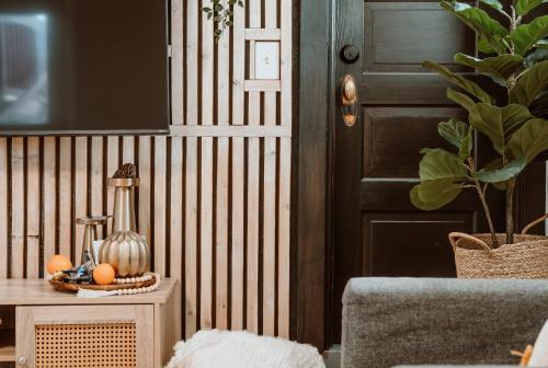 a room with a door and a table with a plant at Southtown Stylin' Corvallis OSU PNW in Corvallis