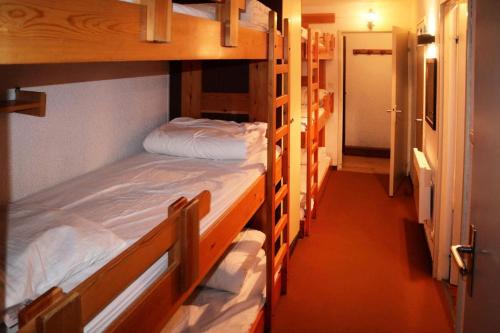 two bunk beds in a room with a hallway at Résidence La Mazeliere - Appartement pour 8 personnes entièrement rénové MAE-3794 in Le Mélézet