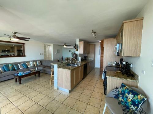a kitchen and a living room with a couch at 506 Ocean & Marina Views 3 Bedroom 2 Bathroom Lux in Fajardo