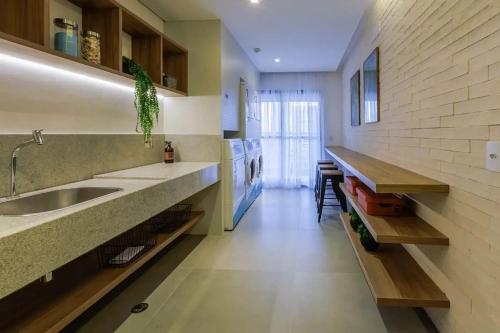 a kitchen with a sink and a counter at Get a Flat 1905 - Brooklin in Sao Paulo