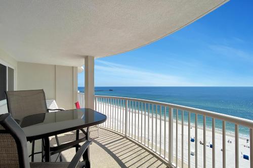 a balcony with a table and a view of the ocean at Royal Palms Unit 1205 in Gulf Shores
