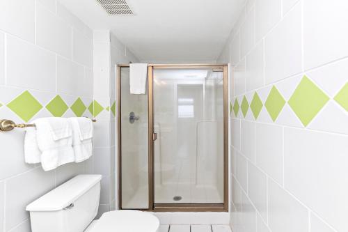 a bathroom with a shower and a toilet at Royal Palms Unit 1205 in Gulf Shores
