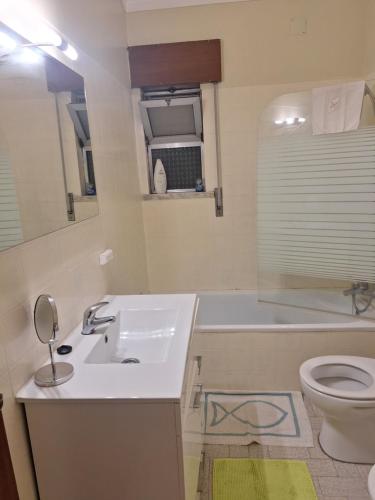 a bathroom with a sink and a toilet at House Prosperity in Amora