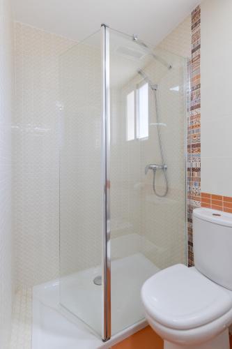 a bathroom with a glass shower with a toilet at Mountain Trails by Fidalsa in Busot