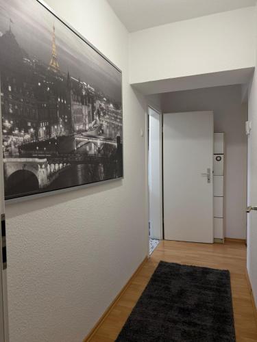 a hallway with a large picture on the wall at Hammer Wohnung in Hamm