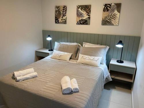 Ένα ή περισσότερα κρεβάτια σε δωμάτιο στο Departamento Home Ycua Sati