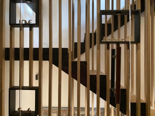 a staircase in a building with a black and white wall at Gite Urbain de qualité in Marche-en-Famenne