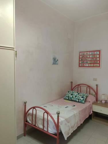 a bedroom with a bed and a refrigerator at Casa Palazzo ducale in Pietragalla