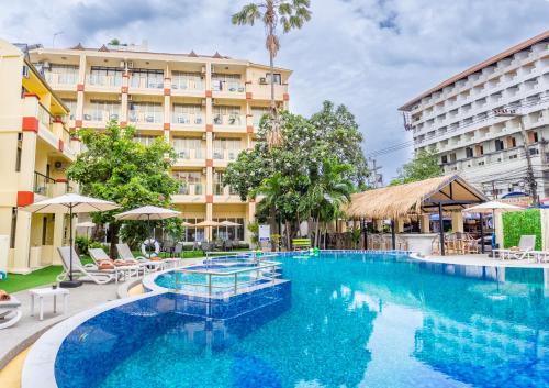 a large swimming pool in front of a hotel at Mermaid Beach Resort - 100m to Beach, Saltwater Pool & BeerGarden in Jomtien Beach