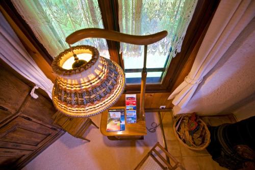 an overhead view of a table with a basket and a window at Chalet familiale spacieux - près de Villars in Huémoz